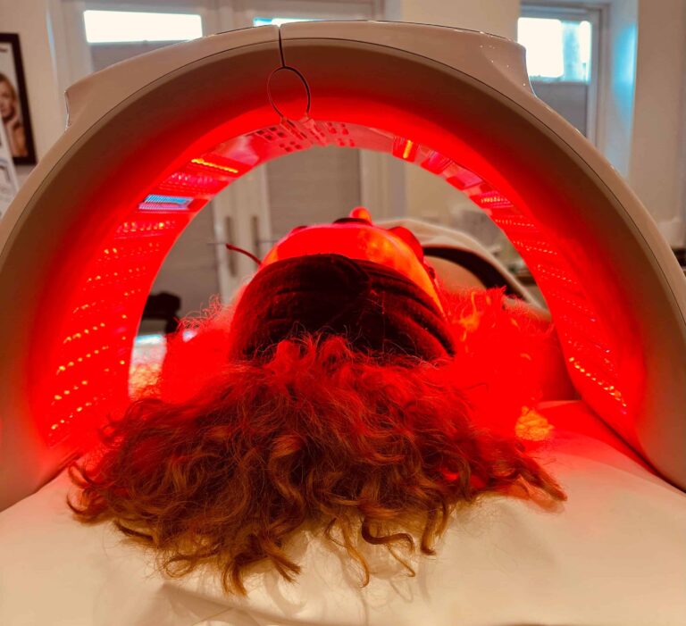 Treatments 23 Woman lying under a red Quantum LED light therapy panel